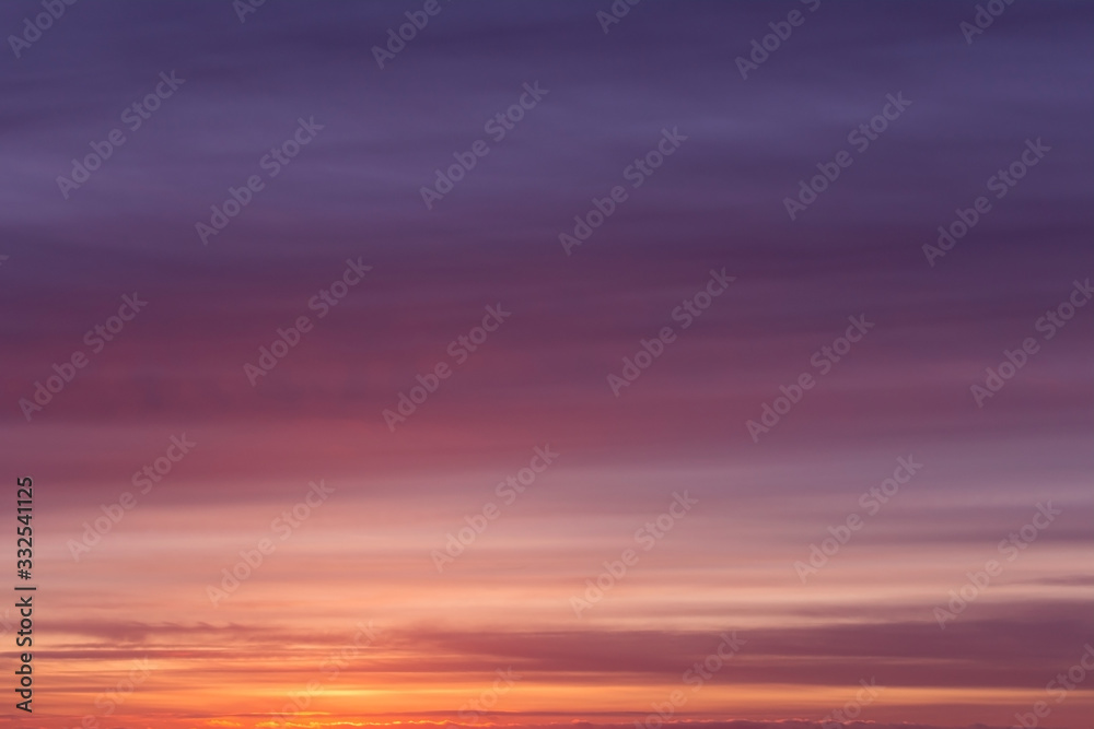 Fototapeta premium Dramatic soft sunrise, sunset pink violet orange blue sky with clouds background texture