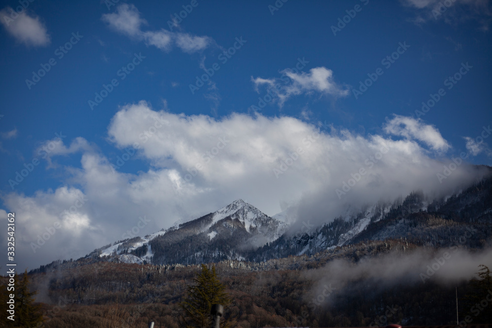 Mountain landscape. Fog and clouds on the peaks.