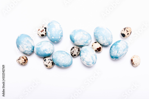 Stylish eggs with ombre blue marble stone effect on white background