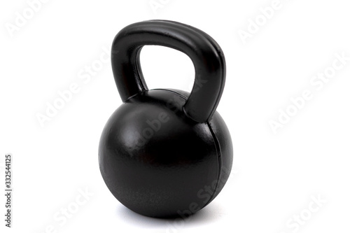 Train with heavy weights, weightlifting exercising and build muscle through resistance training concept with a single black kettlebell isolated on white background with clipping path cutout