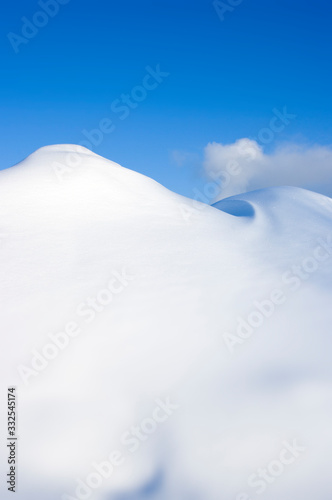 snowy winter mountains and blue sky © Markus Kauppinen