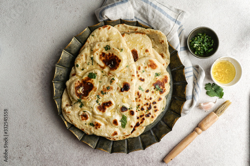 Bild auf Leinwand naan - garlic indian flat bread, tipical in Western Asia, South Asia, Myanmar an