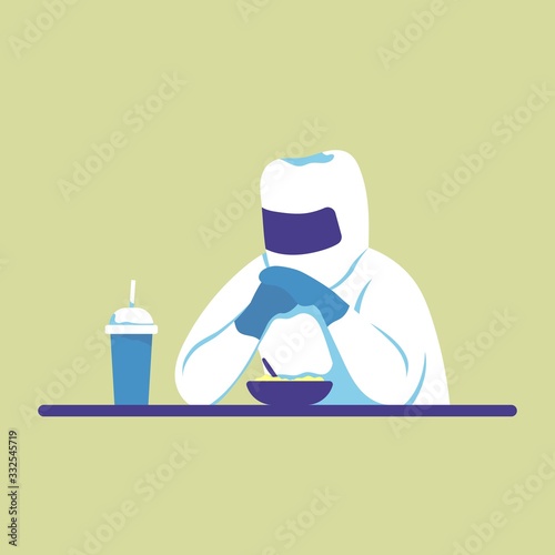 The doctor in uniform is having dinner at the table.