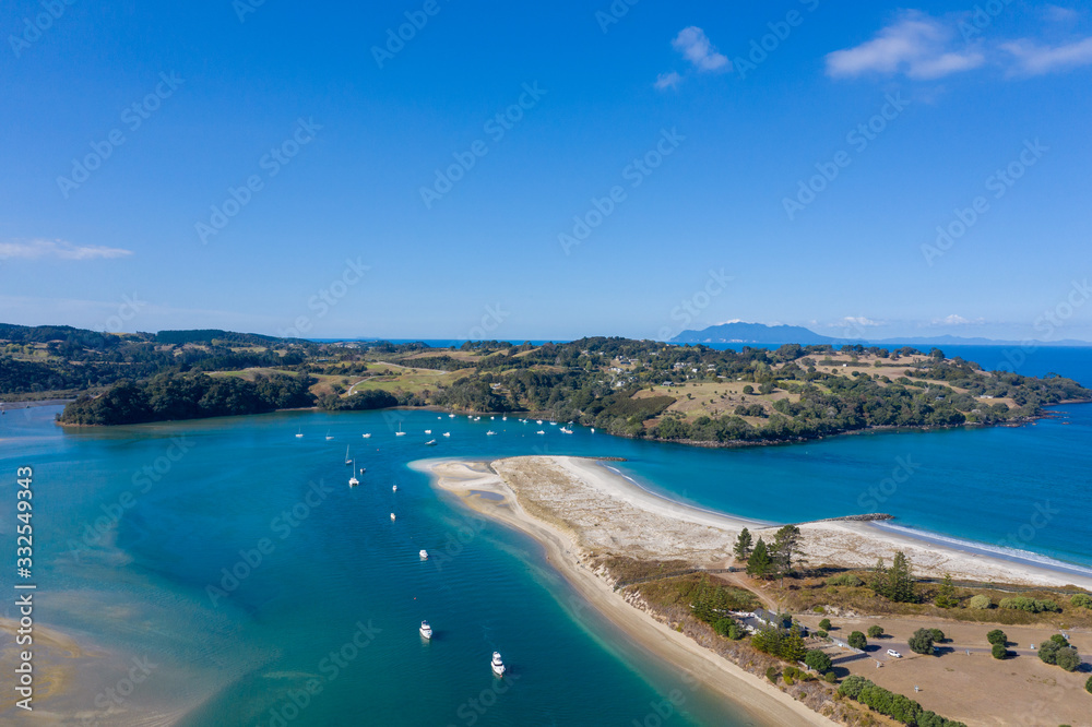 Aerial View from the Beach, Green Trees, City Streets and Waves of Omaha in New Zealand - Auckland Area	