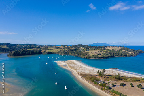 Aerial View from the Beach, Green Trees, City Streets and Waves of Omaha in New Zealand - Auckland Area 