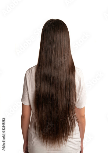 Rear view ,Young woman long hairs and wearing white T-shirt isolated on white background.