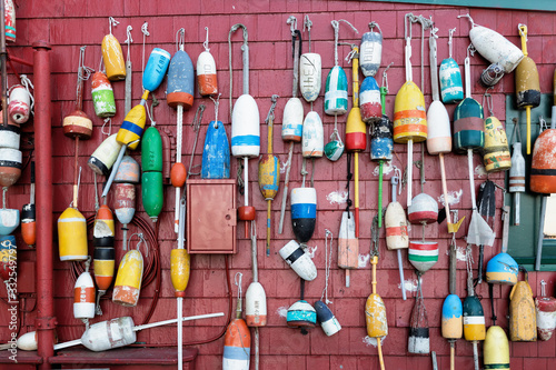 Wooden lobster fishing buoys hanging on the wall 