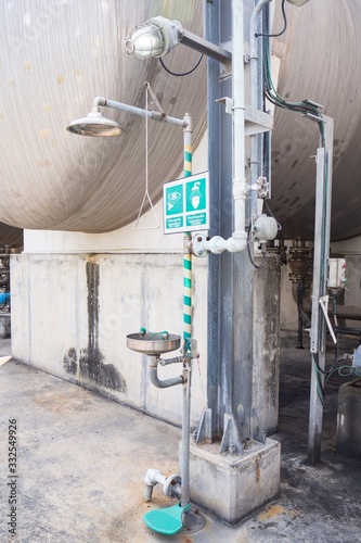Eye shower, body shower near by the vessel, stand by  at working area in chemical plant
