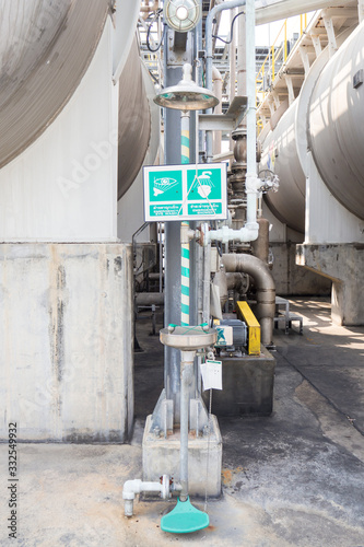Eye shower, body shower near by the vessel, stand by  at working area in chemical plant
