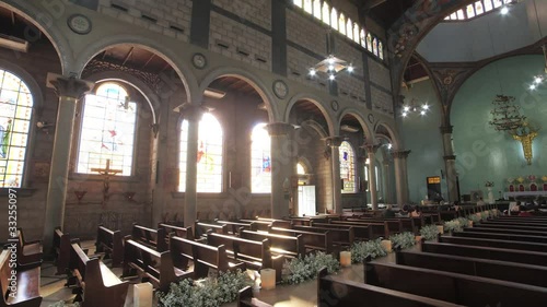 Walking Inside a Catholic Church with Sunbeams Through the Windows photo