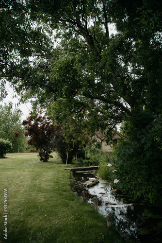  A small river near the house. Spring day in the countryside