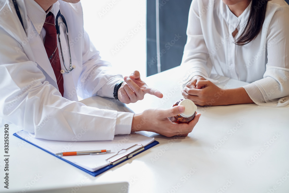 Doctor is explaining about the medication to the patient. Doctor is explaining about the medication to the patient.
