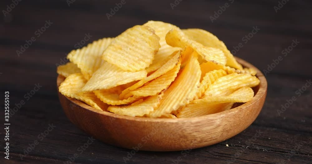 Potato chips on the plate slowly rotated. Potato chips on the plate slowly rotated.