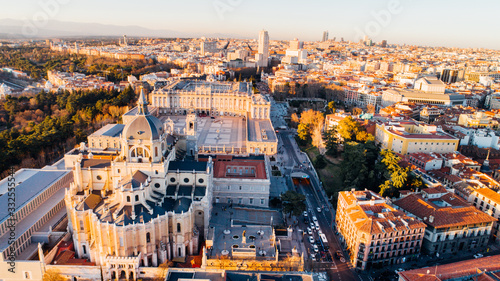 Aerial view of Madrid Cathedral Santa Maria la Real de La Almudena in Madrid, Spain and Royal Palace at sunset. Architecture and landmark of Madrid. Cityscape of Madrid