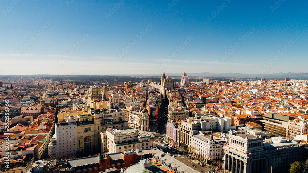 Fototapeta Aerial view of Calle de Alcala and Calle Gran Via.Panoramic aerial view of Gran Via, main shopping street in Madrid, capital of Spain, Europe.Tourist attraction and most famous street.
