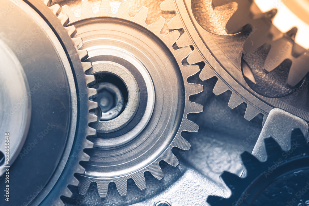 gears industrial background with warm shiny light gears industrial background with warm shiny light