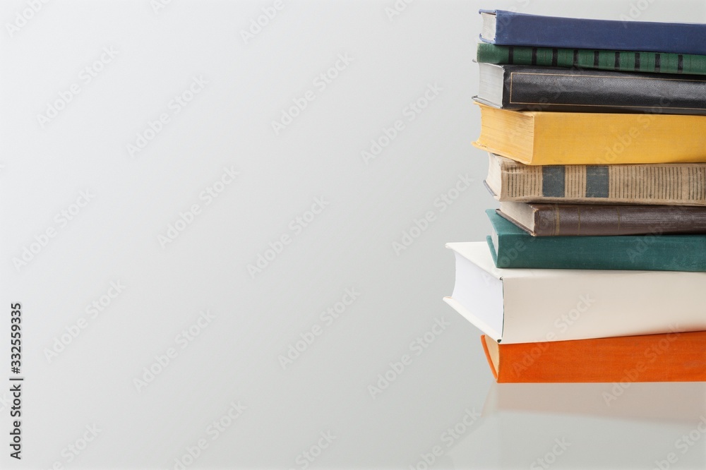 Fototapeta premium Stack of old study books on the desk