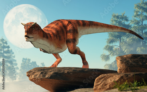 Carnotaurus was a carnivorous theropod dinosaur with horns on its head that lived in Cretaceous era South America. Depicted on a cliff by the moon. 3D Rendering  © Daniel Eskridge