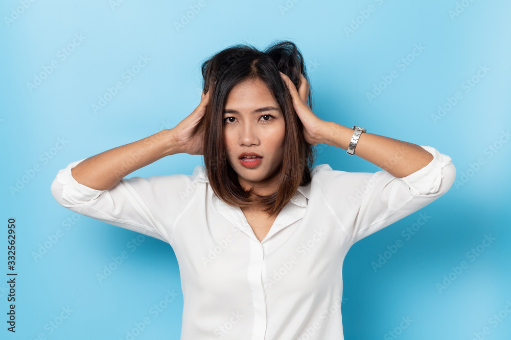 young woman having headache on white background young woman having headache on white background