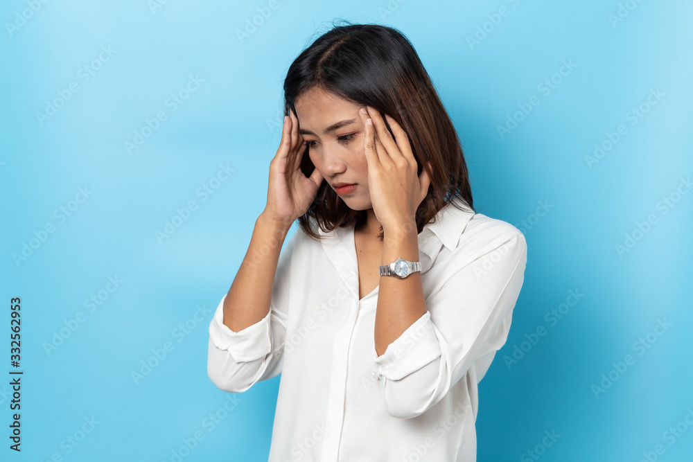 young woman having headache on white background young woman having headache on white background