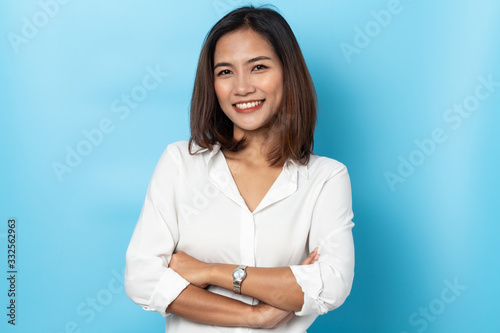 portrait business woman asian on blue background photo
