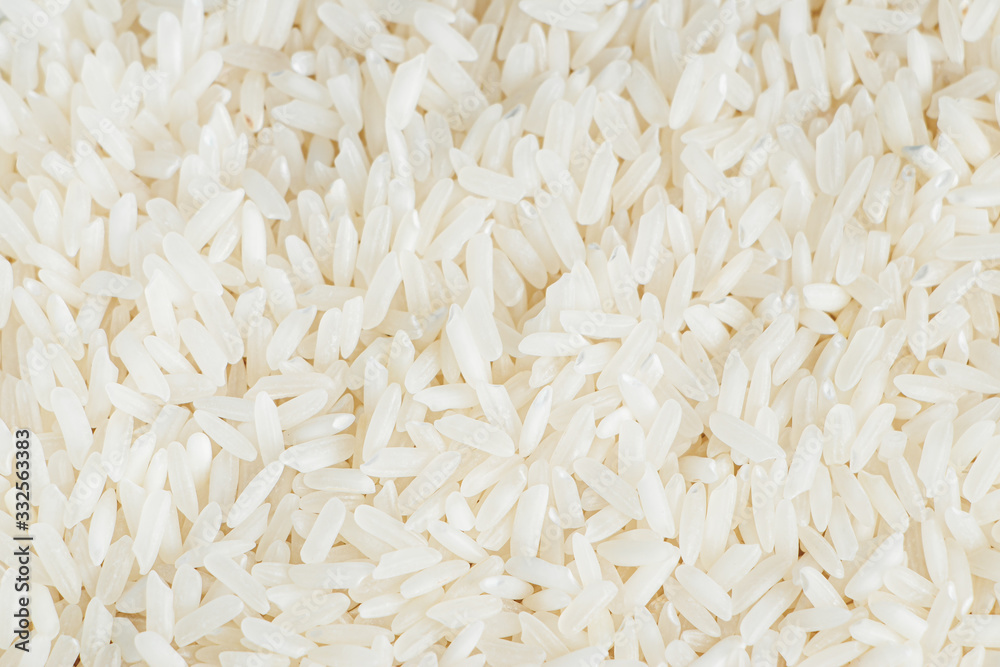 The texture of white rice closeup. Shortage of essential goods.