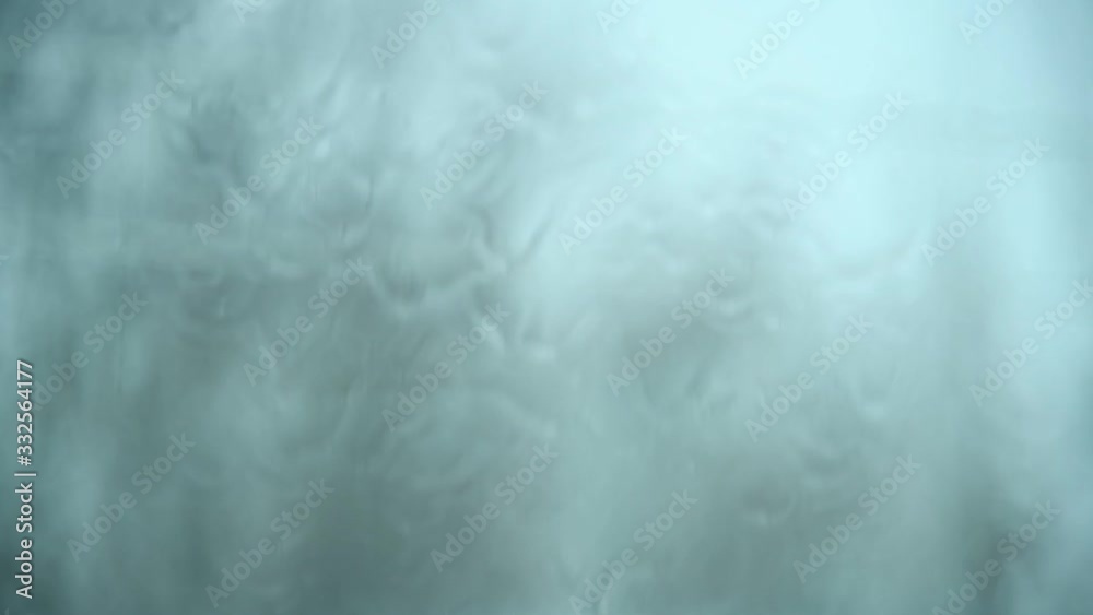 Heavy rain flowing down a window Heavy rain flowing down a window