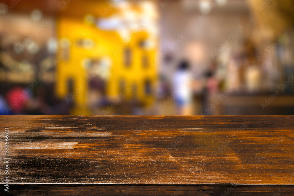 Empty wood table on abstract of blurred restaurant background