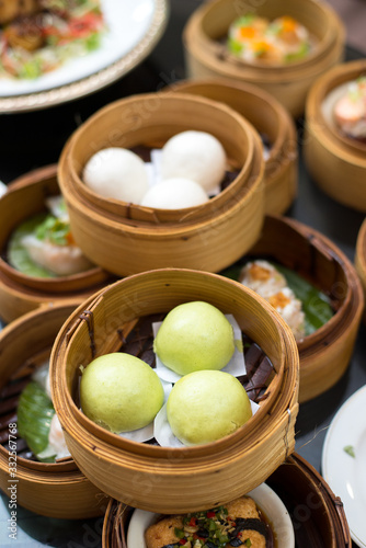 Canvas Print Yumcha , Variety of chinese dim sum in bamboo steamer
