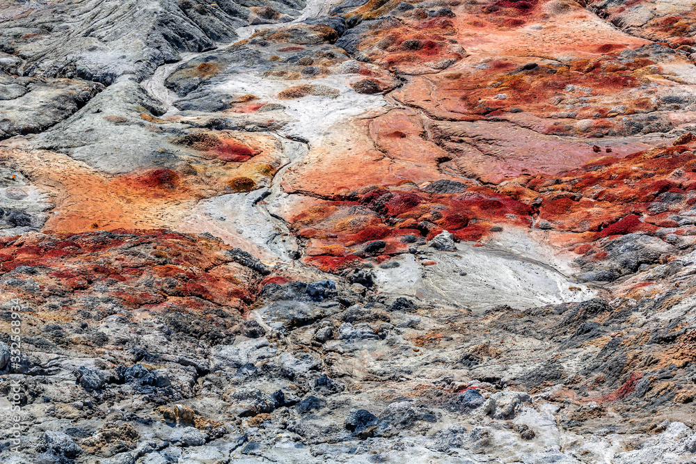 Apocalyptic landscape like a planet Mars surface. Solidified red-brown black Earth surface. Barren, cracked and scorched land. Global warming concept. Refractory clay quarries.