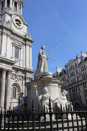 Statue of Queen Anne at outside the west front of St Paul's Cathedral in sunny day, London, UK