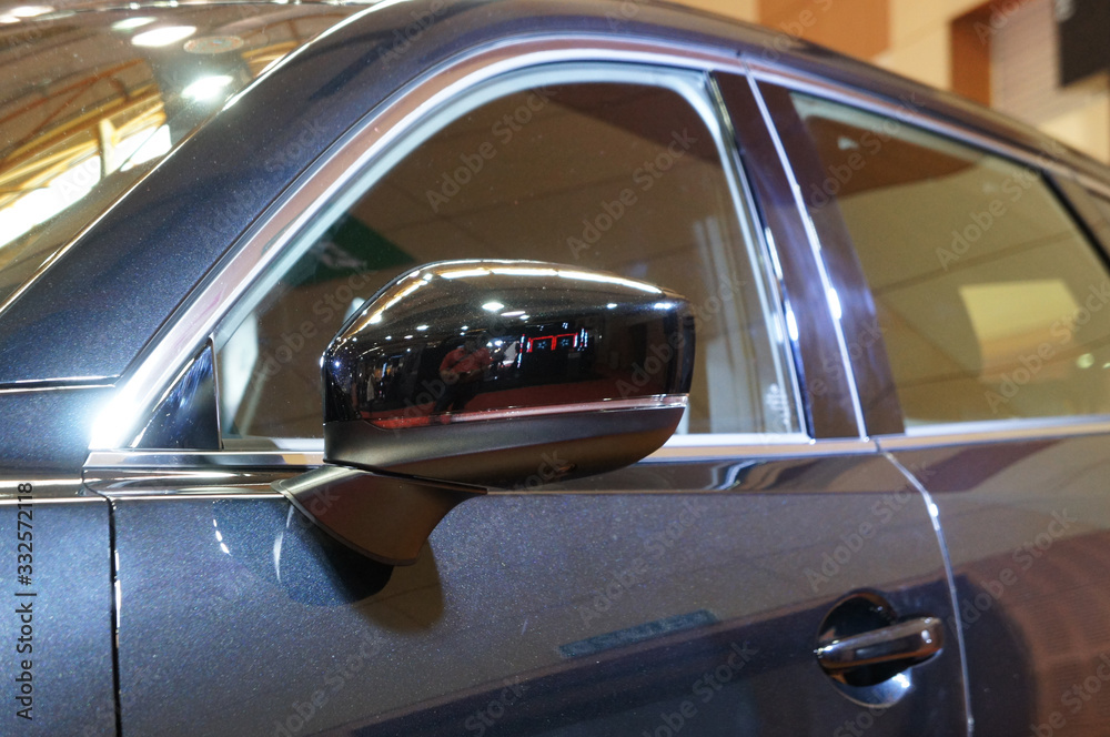Car side mirror or door mirror build at exterior of car for the purposes of helping the driver see areas behind and to the sides of the vehicle.  