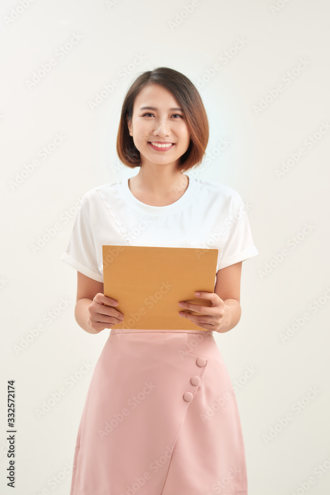 Woman hand holding brown envelope on white background Woman hand holding brown envelope on white background