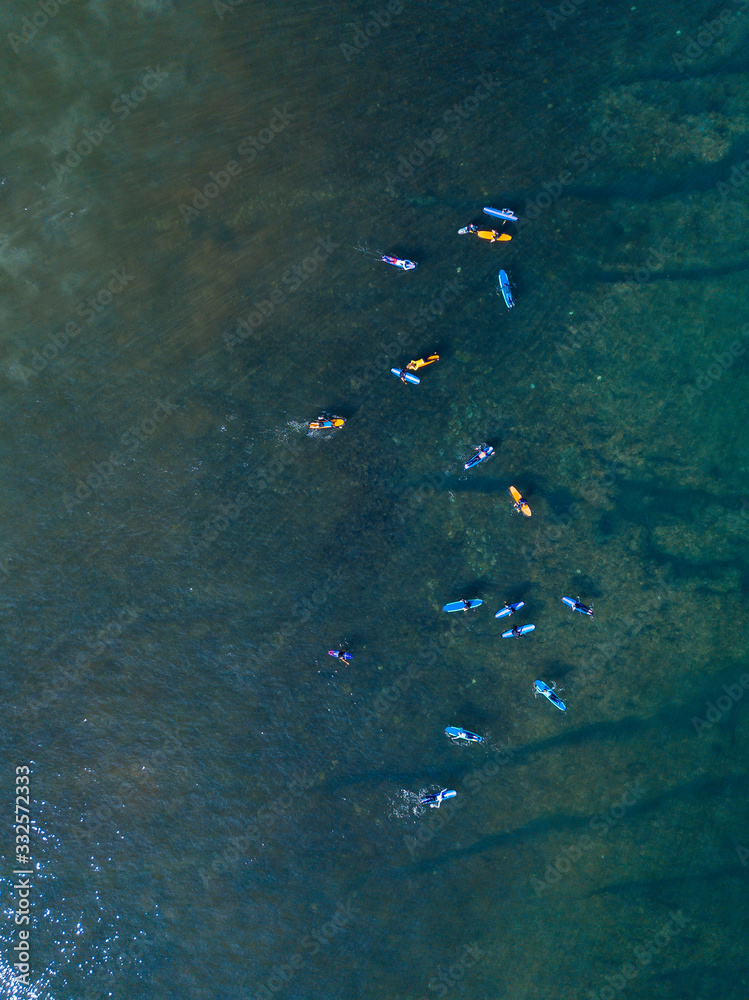Aerial view of group of surfers, Bali, Indonesia Aerial view of group of surfers, Bali, Indonesia