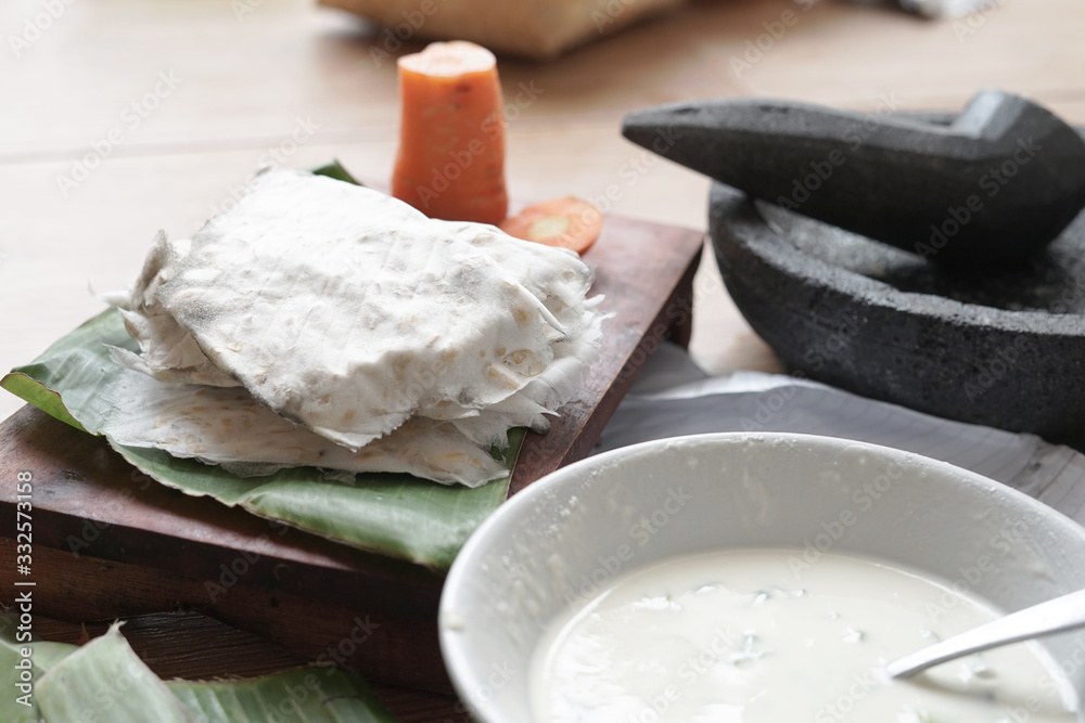 Soybean product called Tempeh or Mendoan raw food ready to cook scene Soybean product called Tempeh or Mendoan raw food ready to cook scene