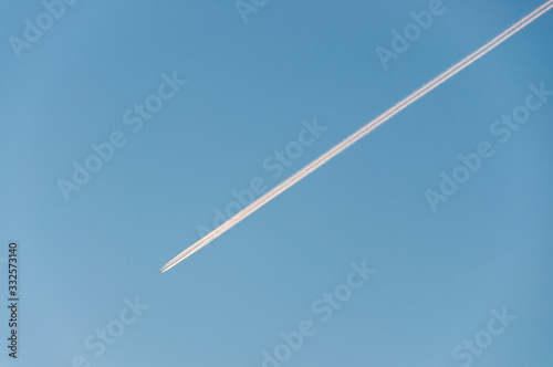 Airplane flying in a striaght line photo