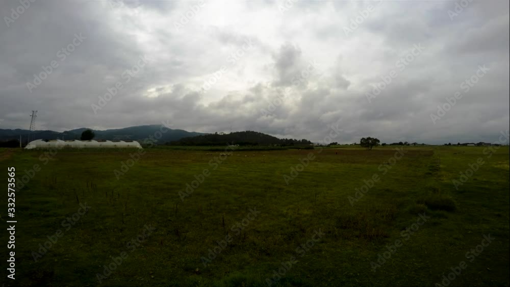 Time lapse of a sheep herd under cloudy sky Time lapse of a sheep herd under cloudy sky
