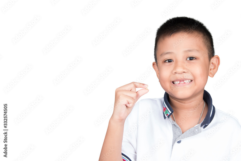 Asia kid showing his first milk tooth. Asia kid showing his first milk tooth.