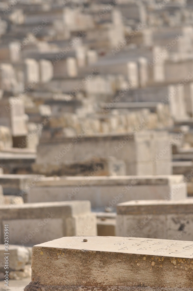 Fototapeta premium Jerusalem. Stone slabs with stones instead of flowers left by praying for the dead.