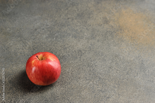 red Apple on a gray background - top view