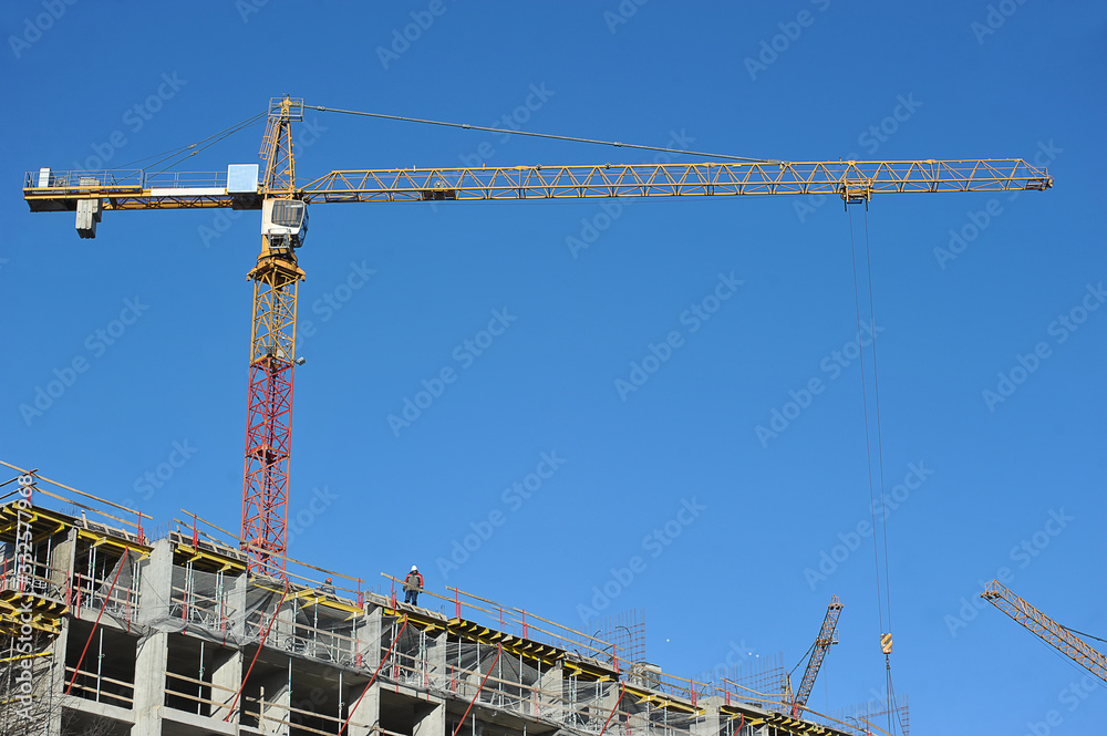 construction cranes on the construction site construction cranes on the construction site