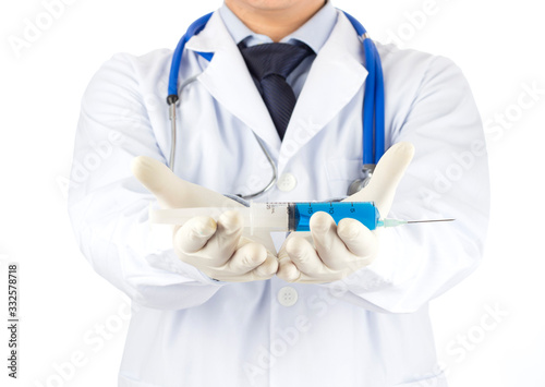 the doctor picked up the vaccine with a syringe in his hand