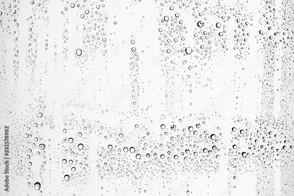 white isolated background water drops on the glass / wet window glass with splashes and drops of water and lime, texture autumn background white isolated background water drops on the glass / wet window glass with splashes and drops of water and lime, texture autumn background