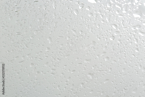 wet glass background condensate / abstract rain, drops texture on transparent glass