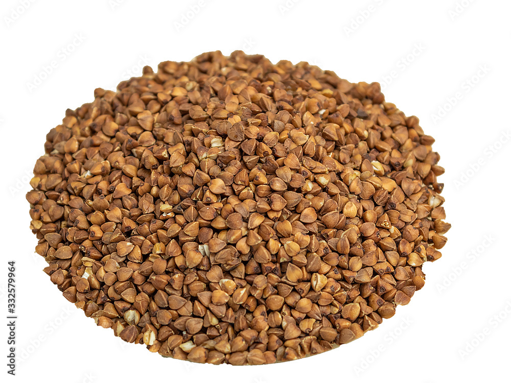 Buckwheat groats in a glass plate on a wooden background Buckwheat groats in a glass plate on a wooden background
