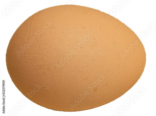 Chicken egg in a glass plate on a wooden background