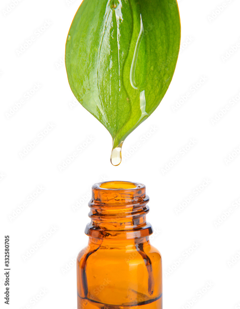 Pouring of perfume essential oil into bottle on white background - obrazy, fototapety, plakaty 
