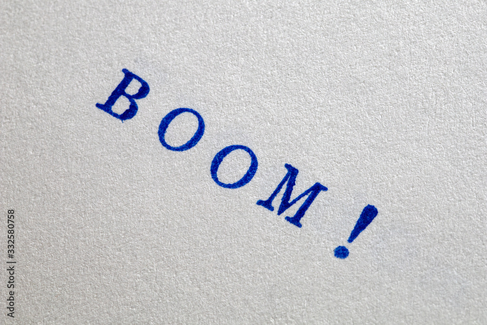 a boom word stamped on a piece of paper.