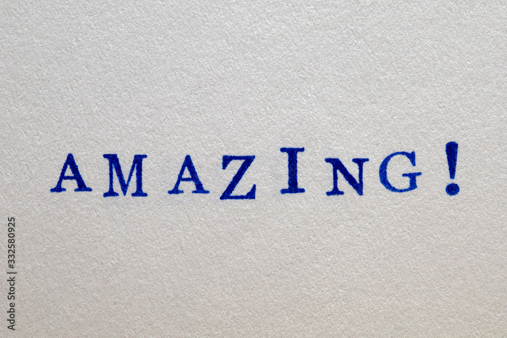 a amazing word stamped on a piece of paper.