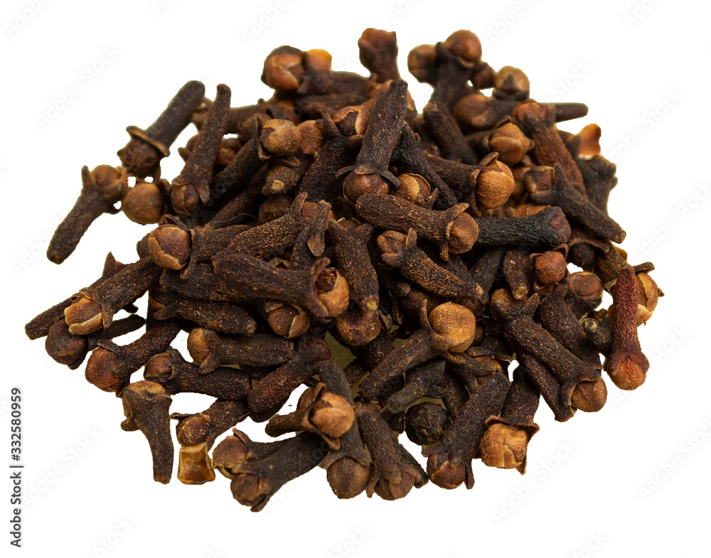 Dry clove spices in glass plate on wooden background Dry clove spices in glass plate on wooden background